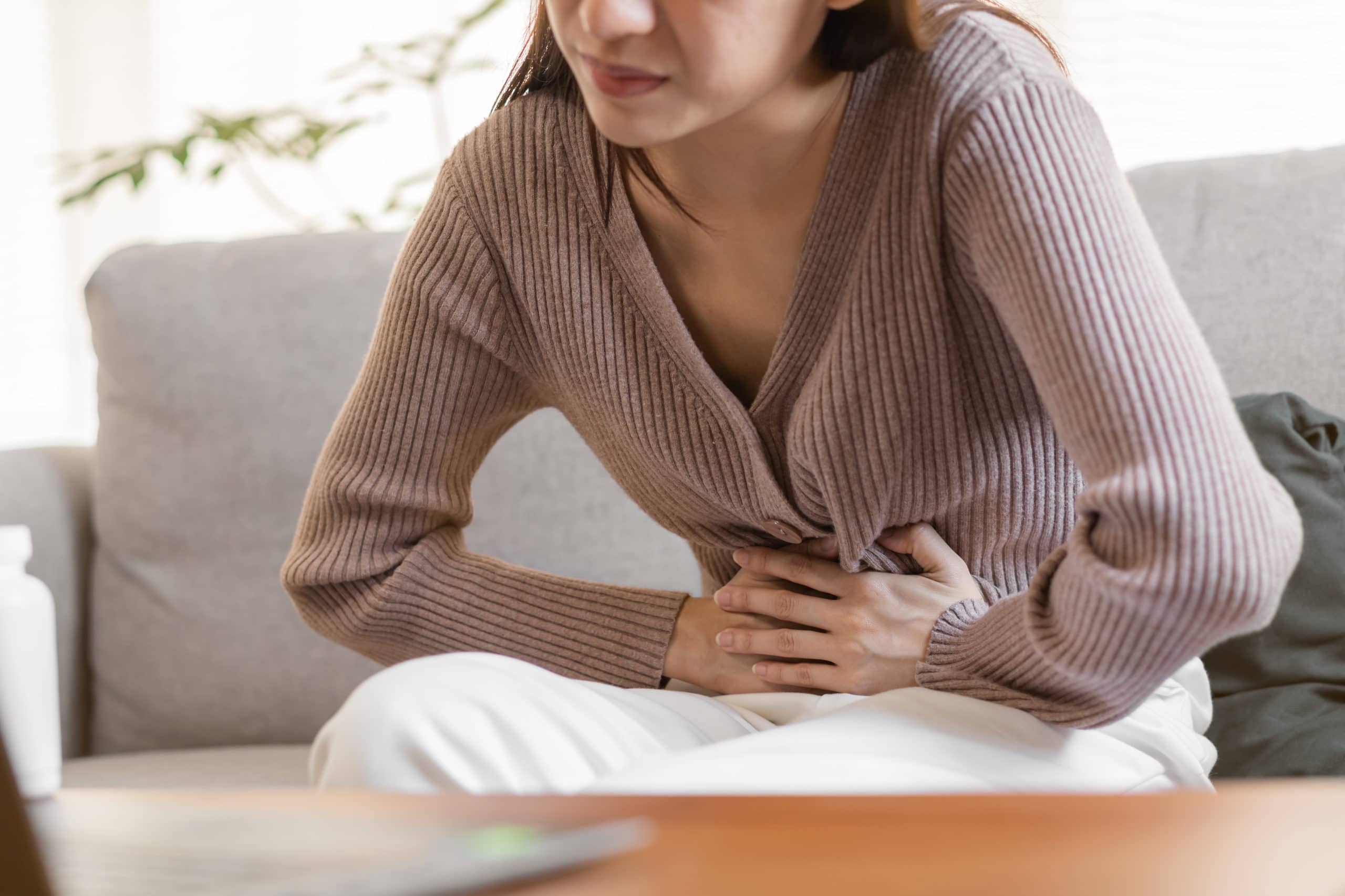 Flatulence,young,asian,woman,,girl,hand,in,stomach,ache,,suffer
